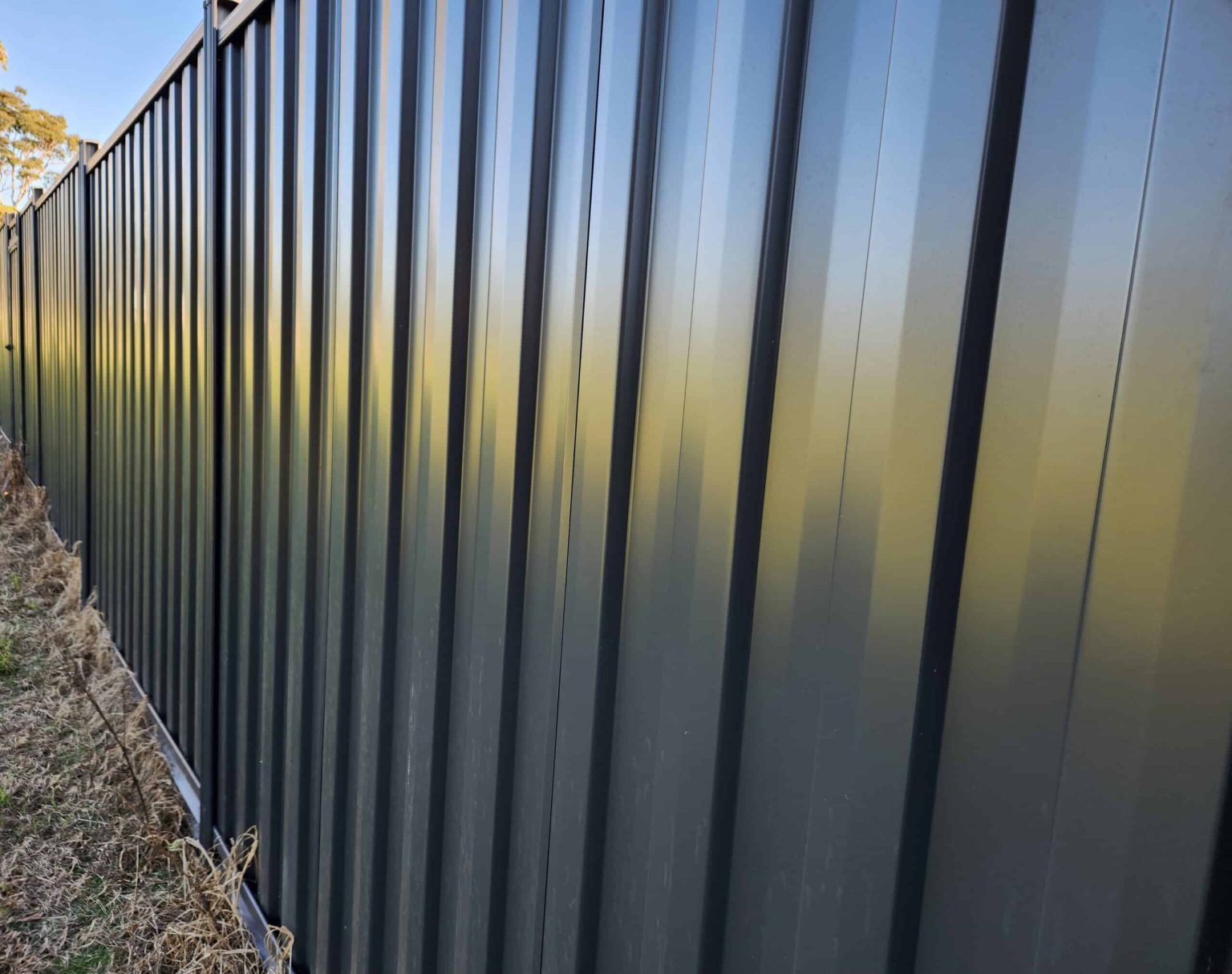 10 Questions to Ask a Colorbond Fence Company Before You Sign a Quote Colorbond steel fence installer